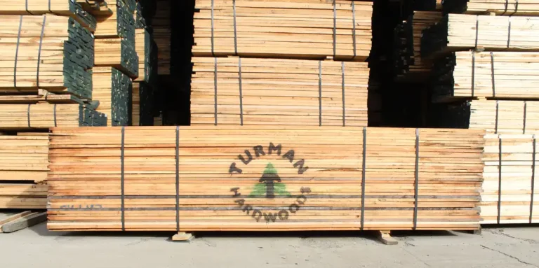 Strapped bundles of FAS cherry hardwood lumber stacked at Turman Sawmill.